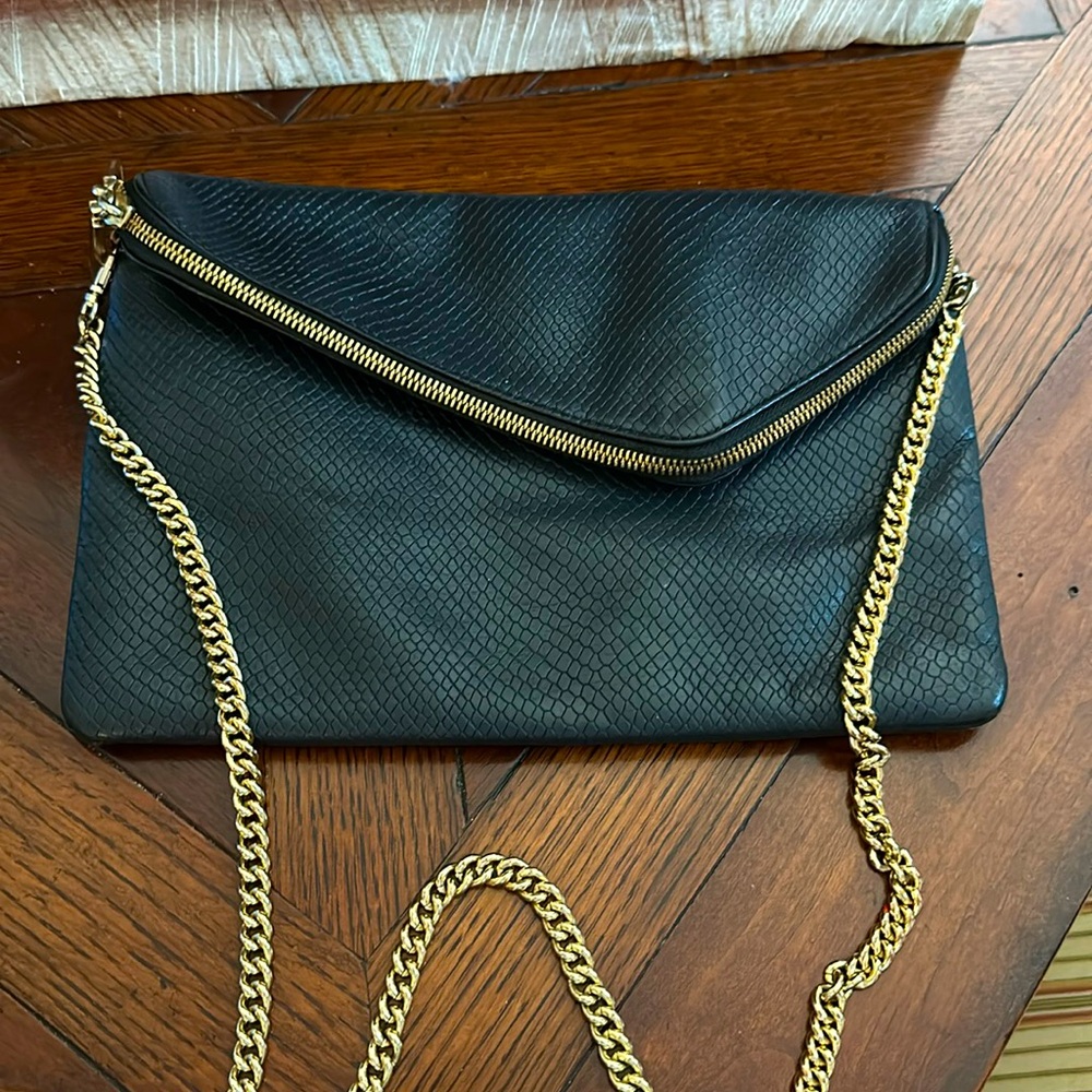 Rare Henri Bendel crossbody fold over bag on gorgeous weighted gold chain.